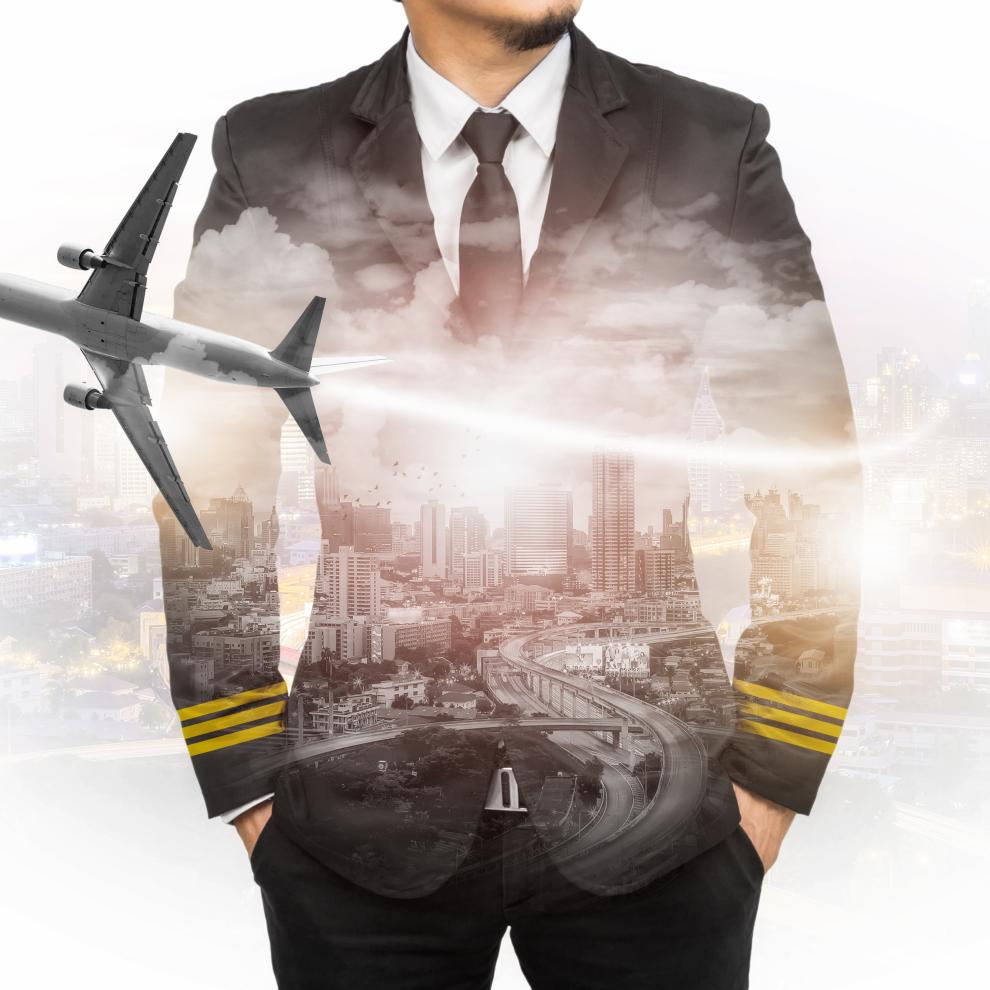 Pilot standing in front of the city view where plane is flying